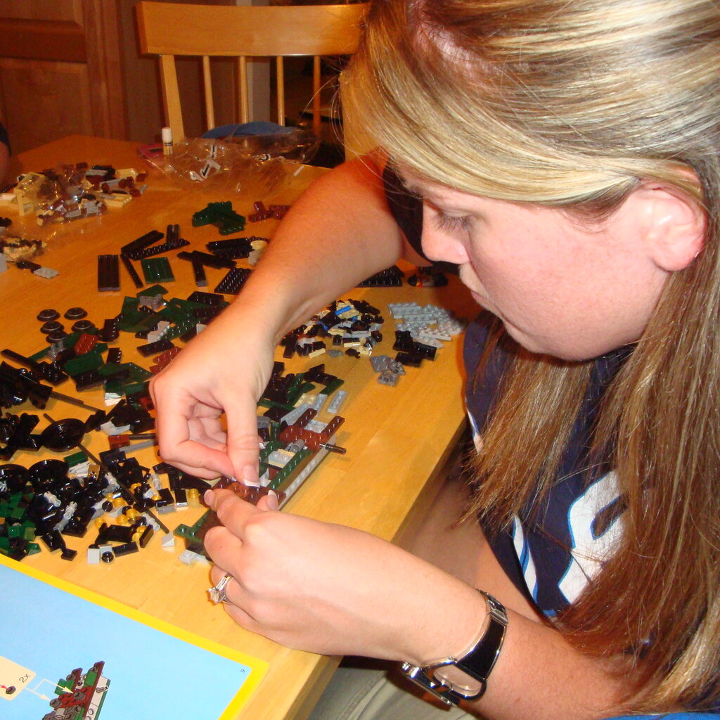 Photo of someone building something out of lego