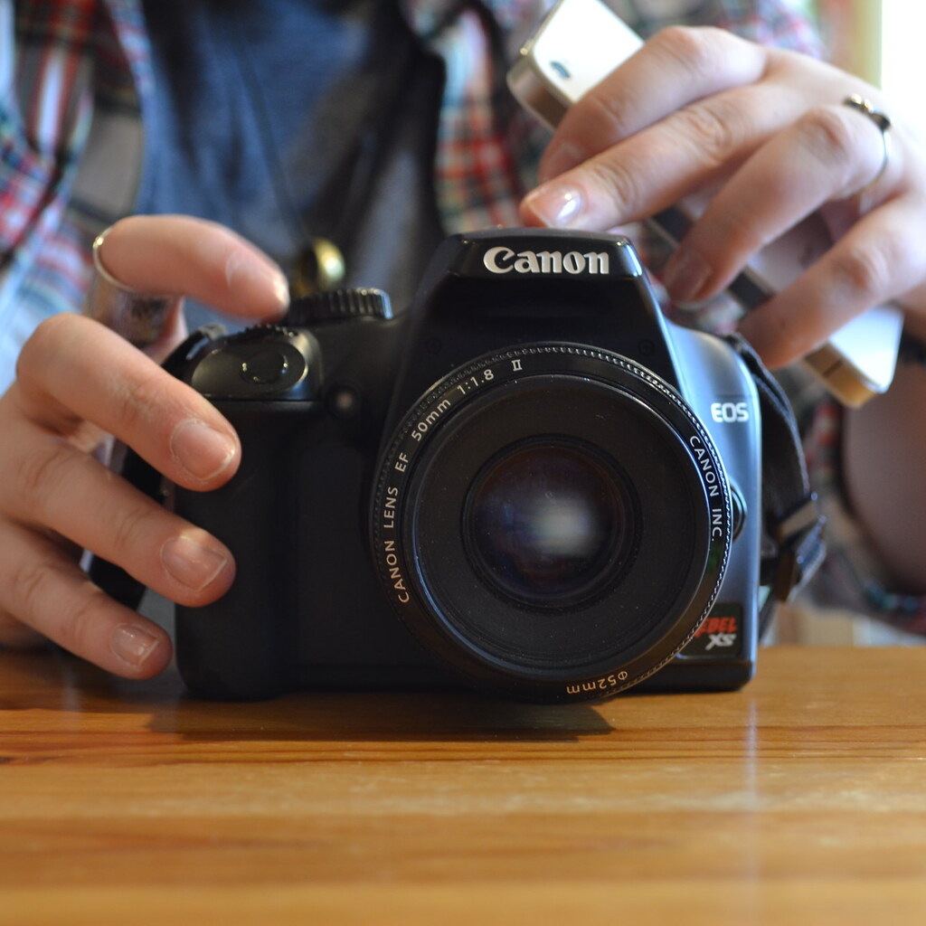 Photo of a man holding a camera