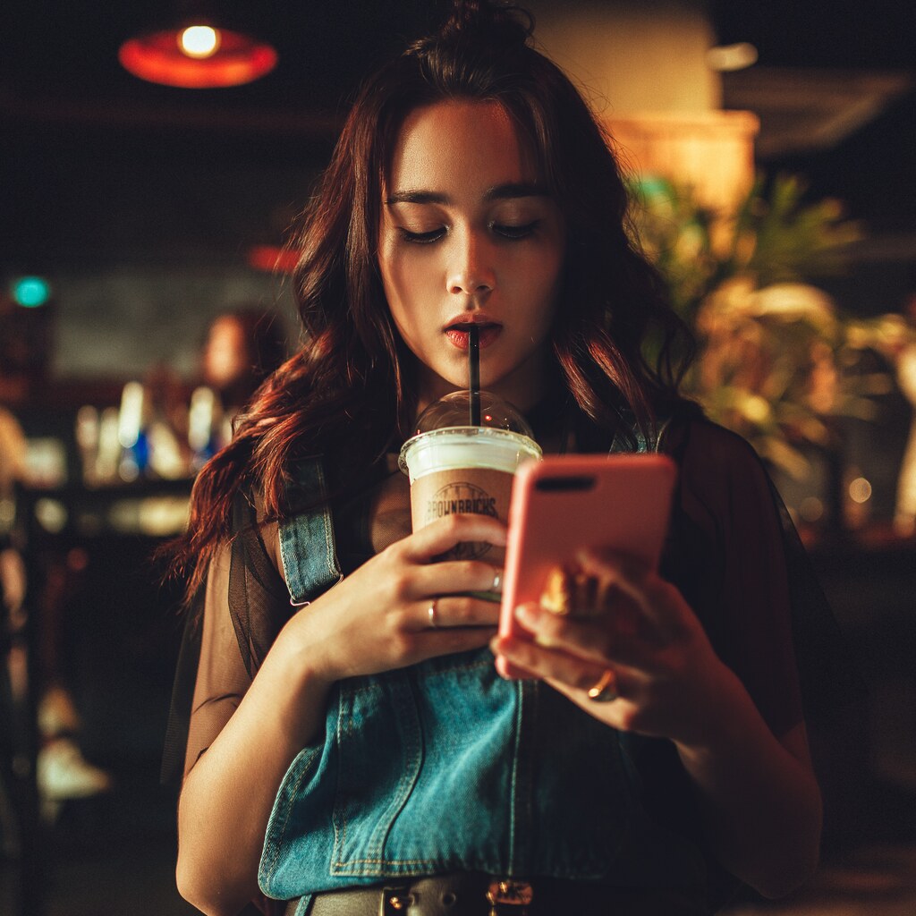 Photo of a young woman using a cellphone