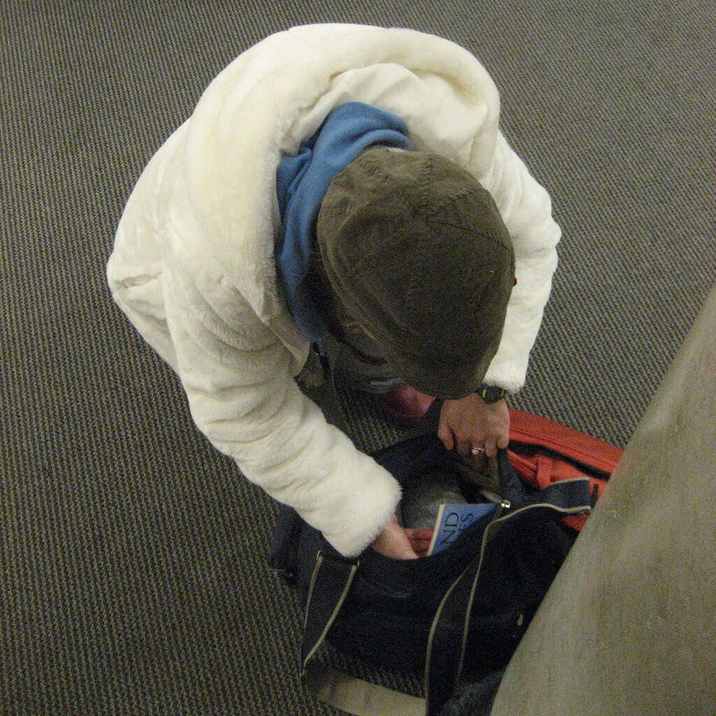 Photo of a man checking his bag