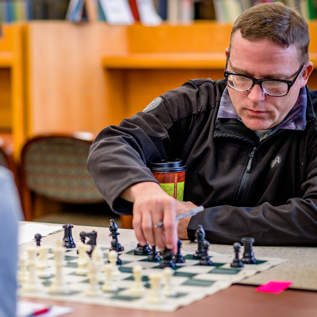 Photo of some people playing chess