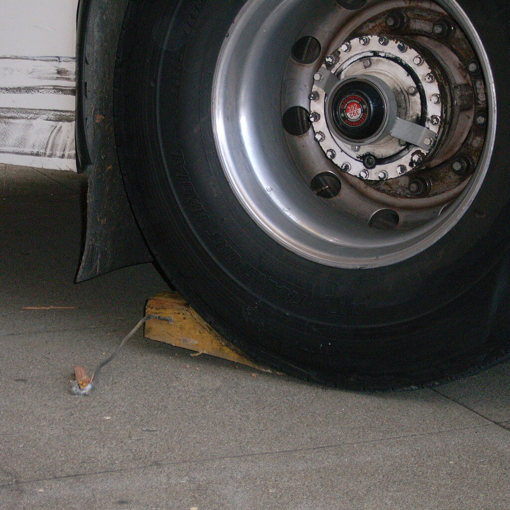 Photo of a chock under a wheel