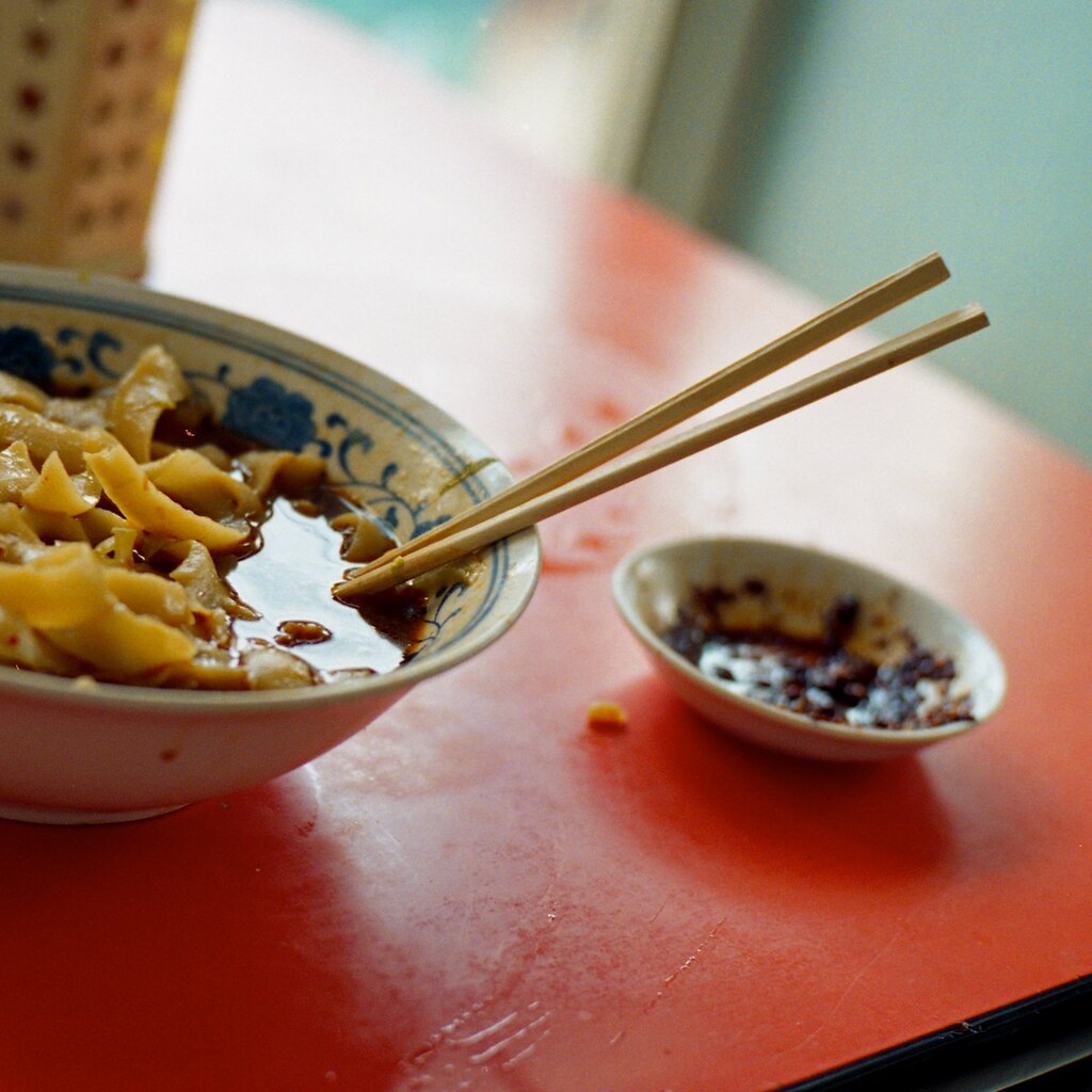 Photo of chopsticks in a bowl.