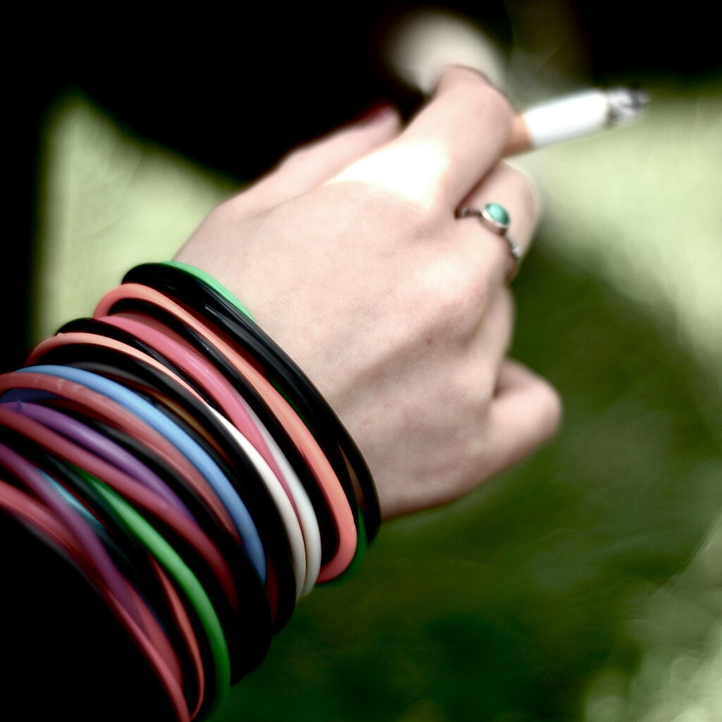 Photo of a hand holding a cigarette