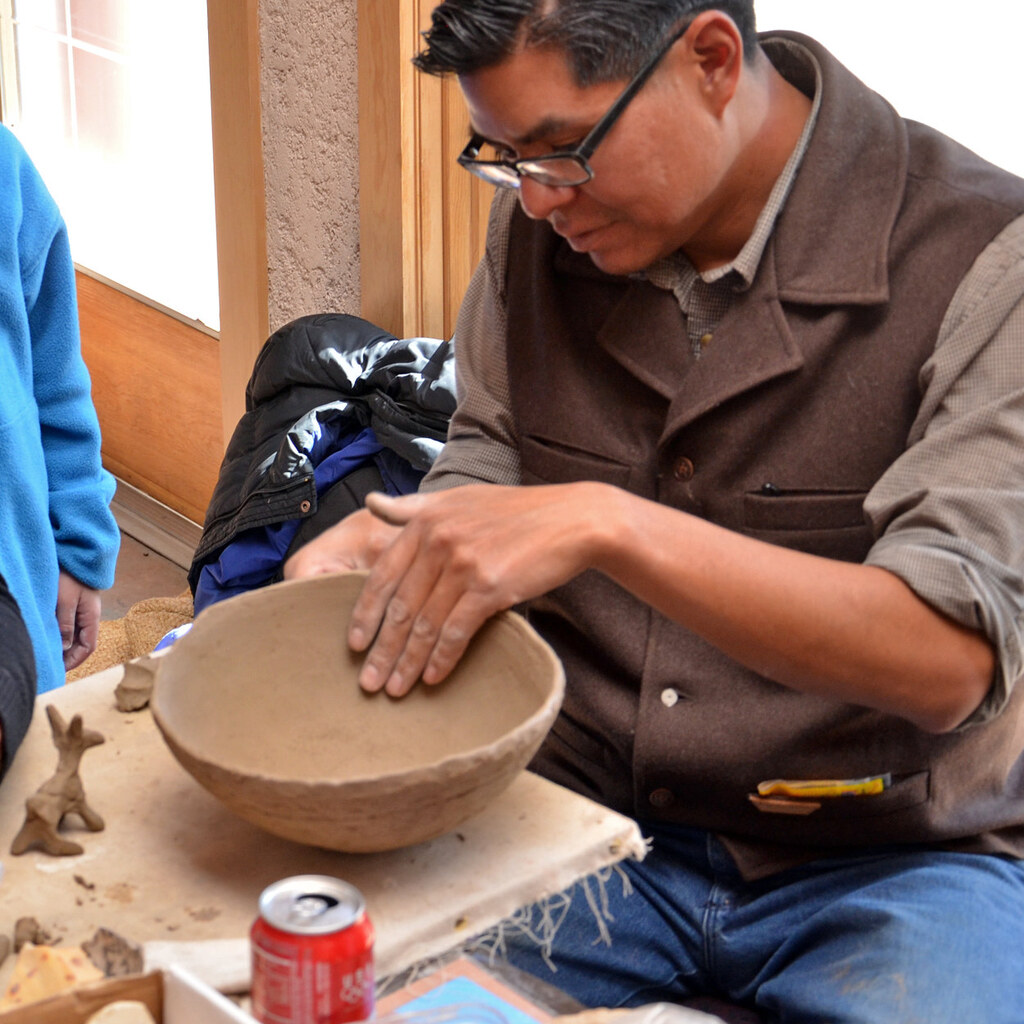 Photo of a potter making a pot