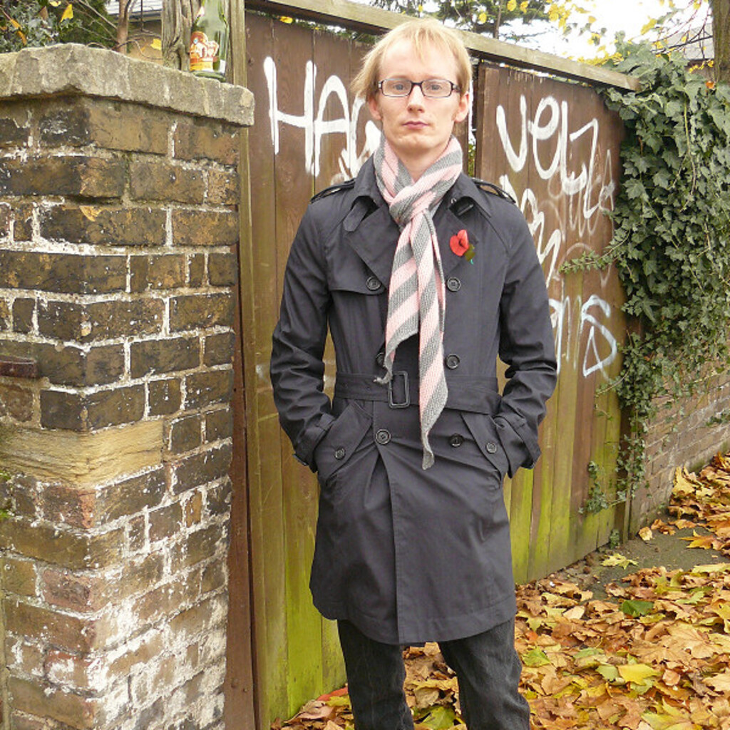 Photo of a man wearing a coat.