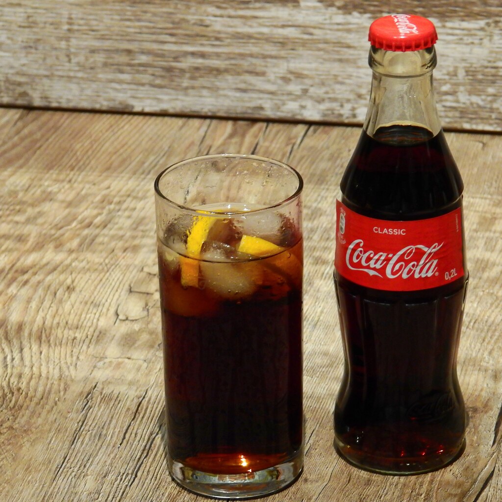 Photo of a glass of cola with ice