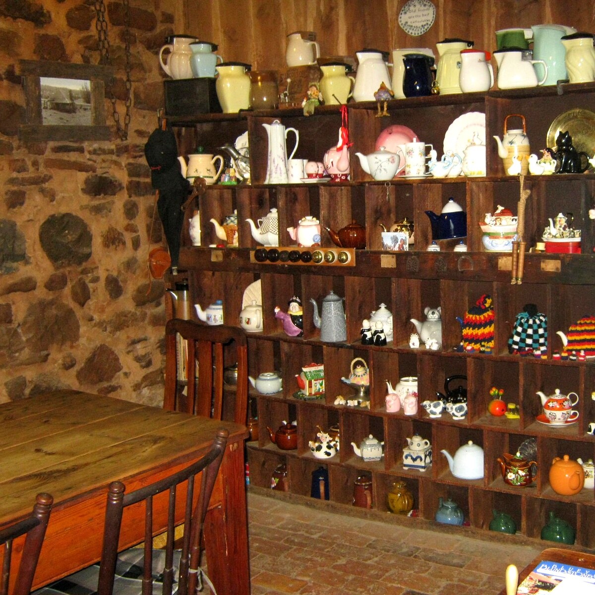 A photo of a collection of teapots