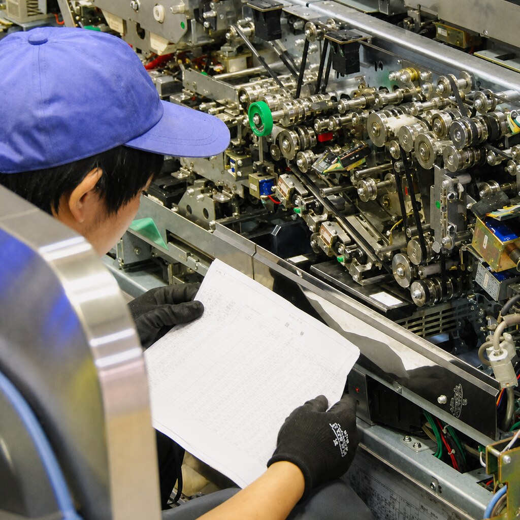 Photo of someone with some complicated machinery