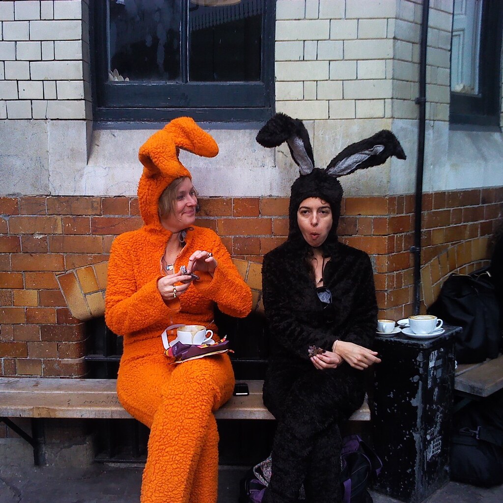 Photo of two people wearing easter bunny costumes