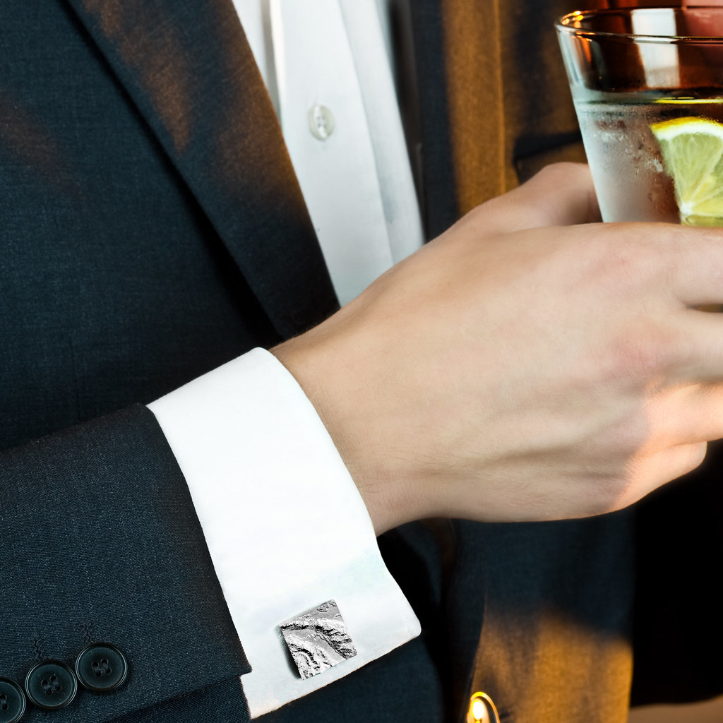 Photo of some silver cufflinks.