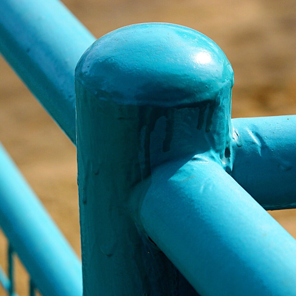 Photo of a rail painted cyan.