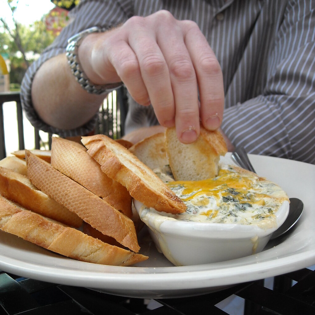 Photo of someone dipping bread