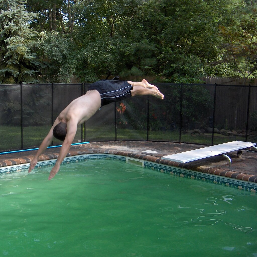 Photo of someone diving into a swimming pool