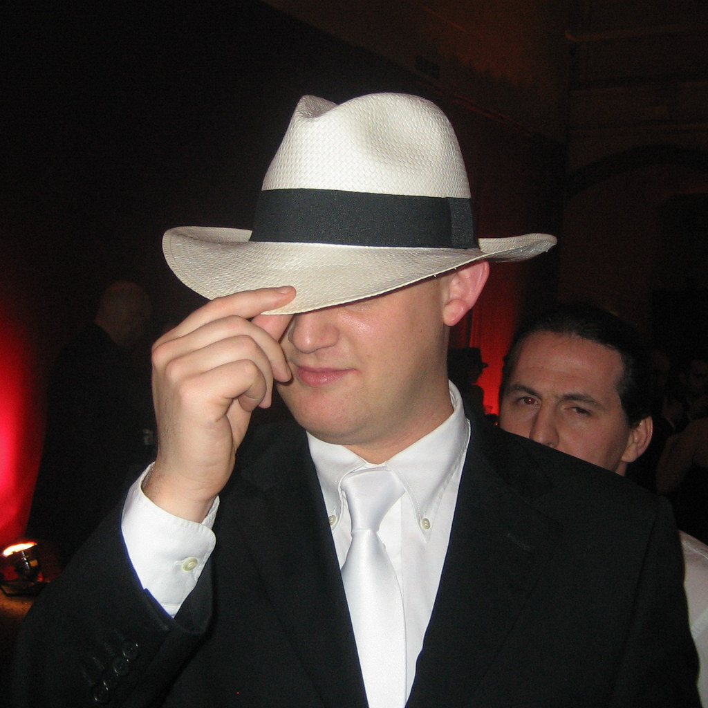Photo of a man doffing his hat