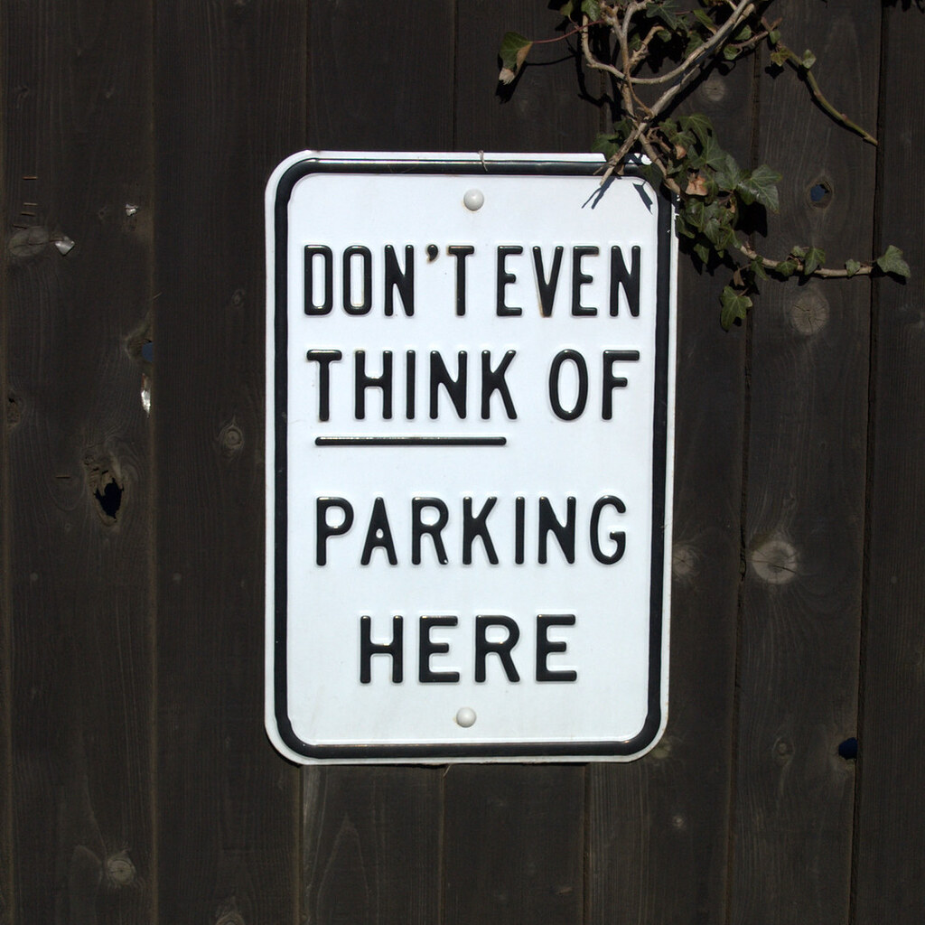 Photo of a don't park here sign