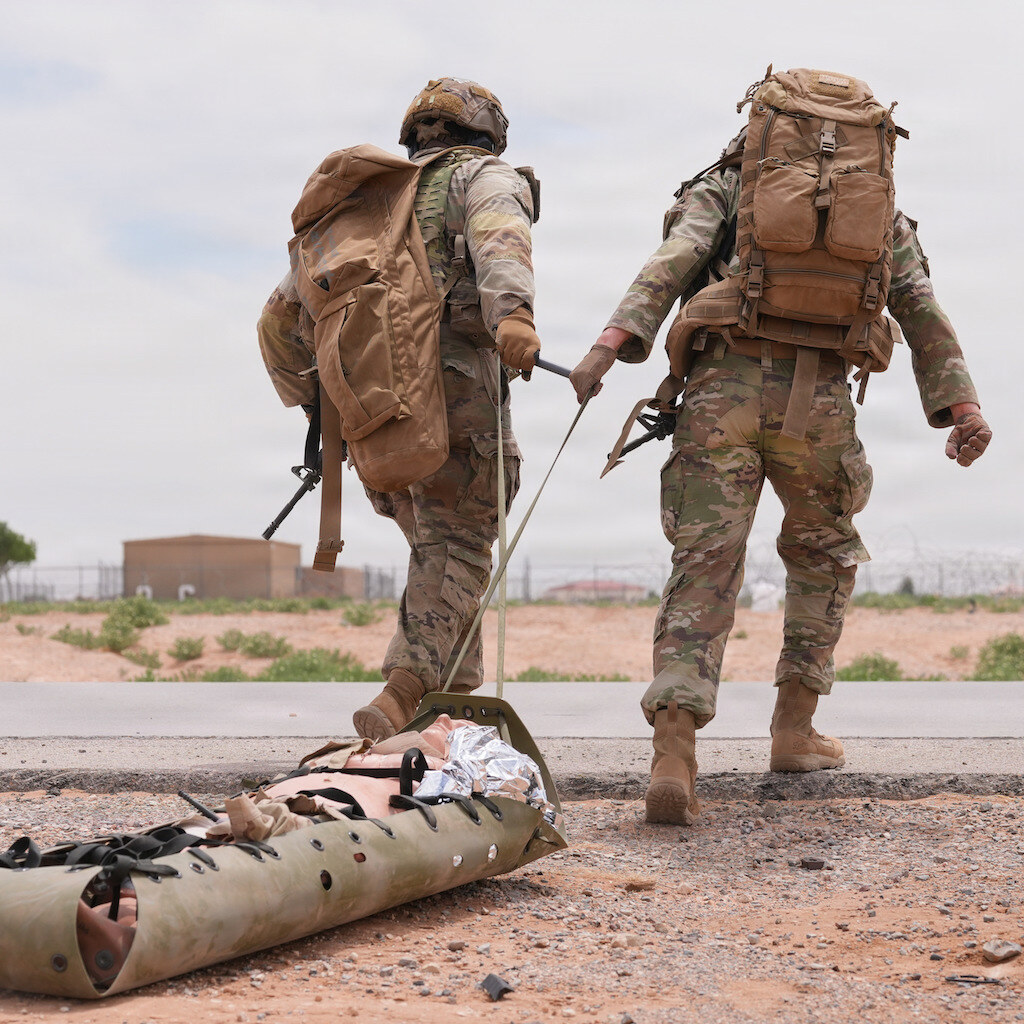 Photo of soldiers dragging a dummy wounded soldier