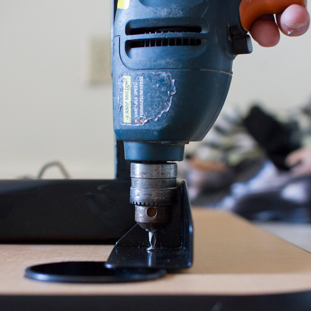 Photo of a man drilling