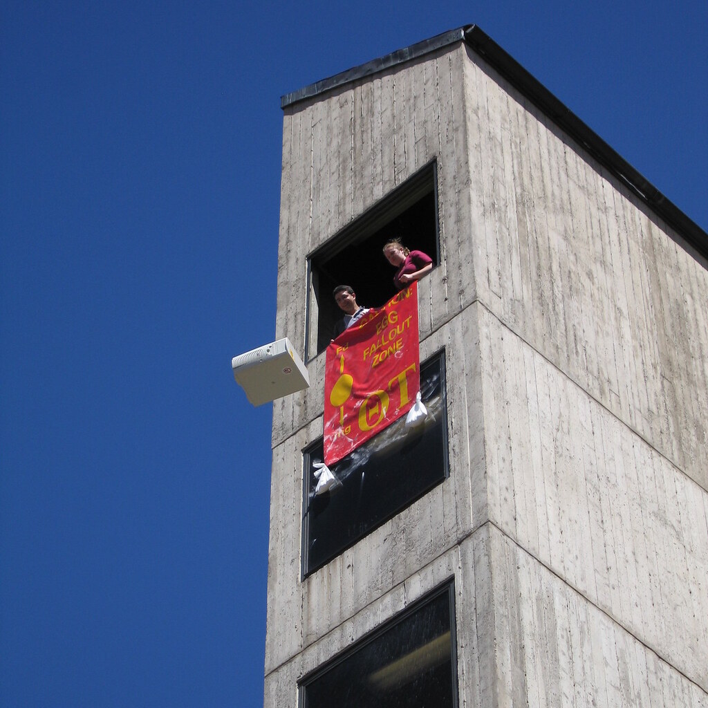 Photo of students dropping something out of a window