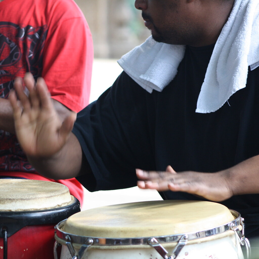 Photo of a man playing the drums.
