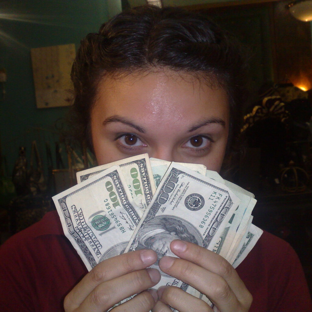Photo of a woman with money