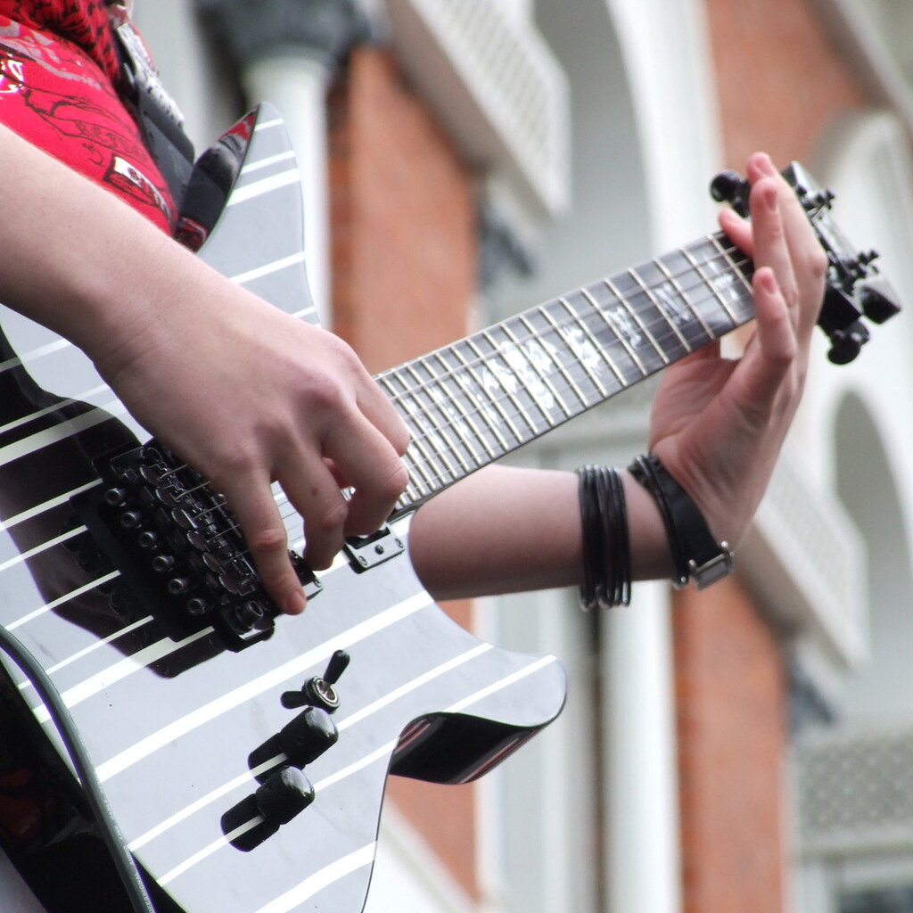 Photo of someone playing an electric guitar