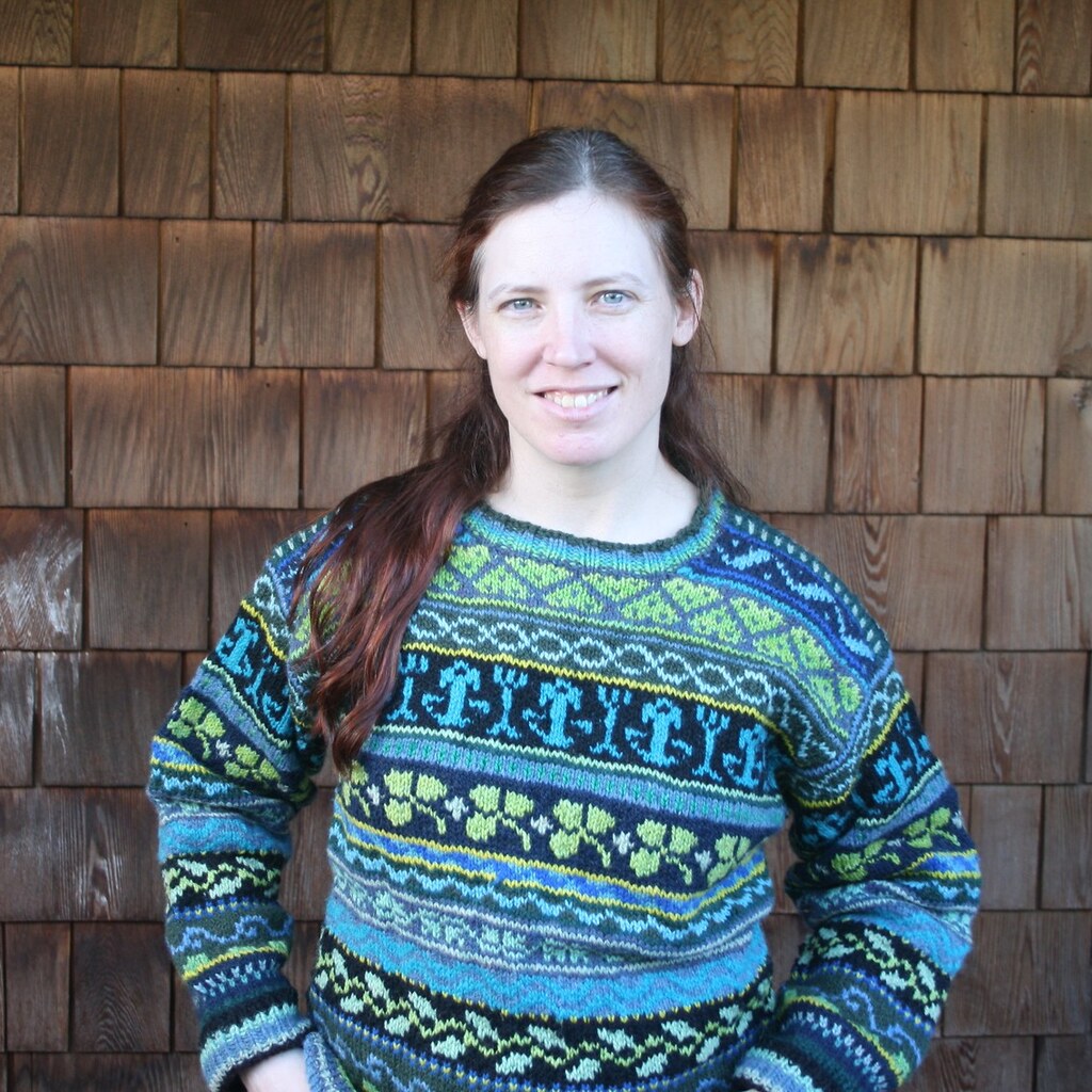 A woman wearing a fair isle sweater.