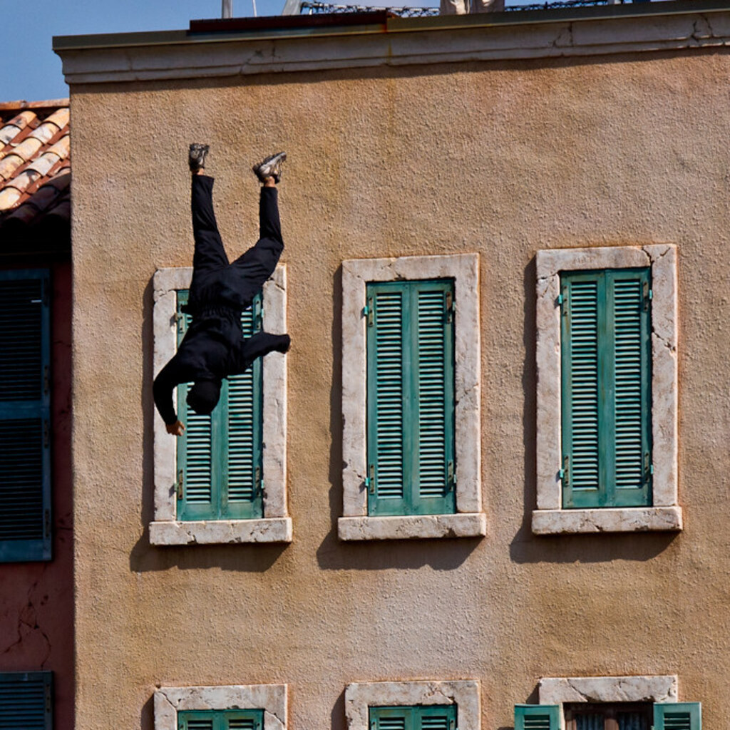 Photo of a man falling off a building