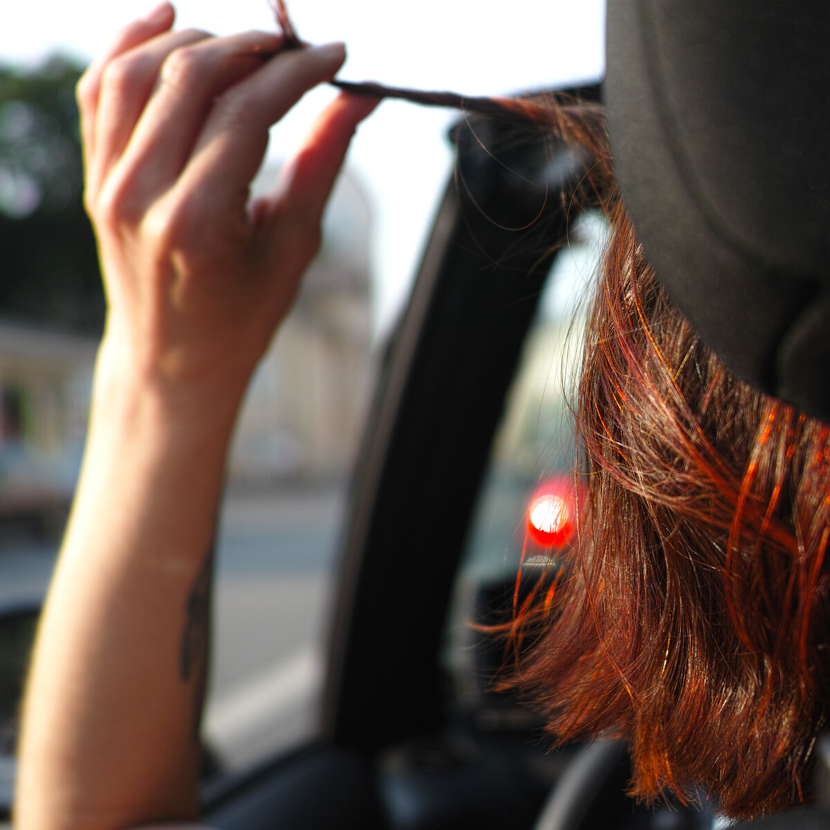 Photo of a woman fiddling with her hair
