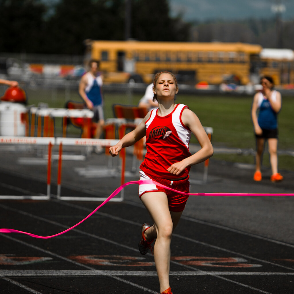 Photo of a woman finishing a race