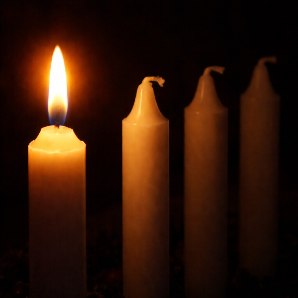 Generated image of one of four candles lit
