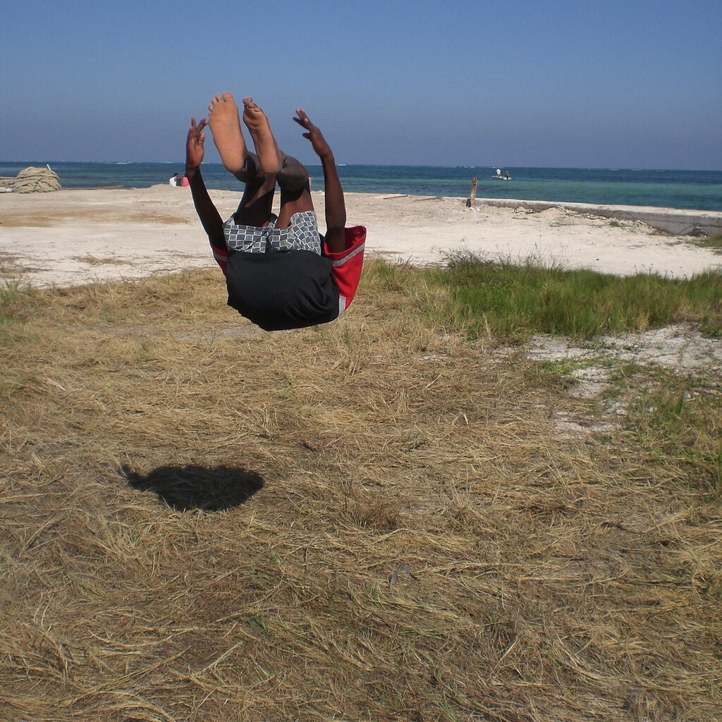 Photo of a boy doing a backflip