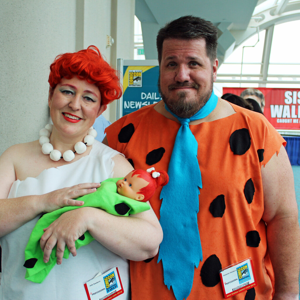 Photo of people cosplaying the Flintstones