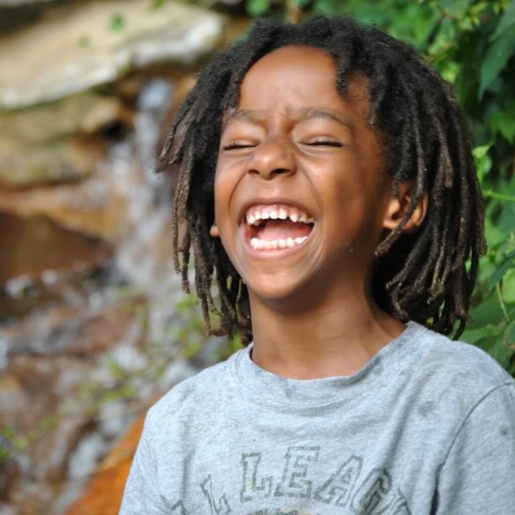 Photo of a child laughing