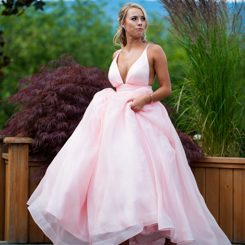 Photo of a woman wearing a pink gown.