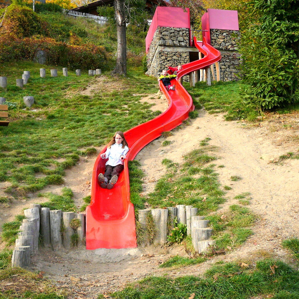Photo of children going down a slide