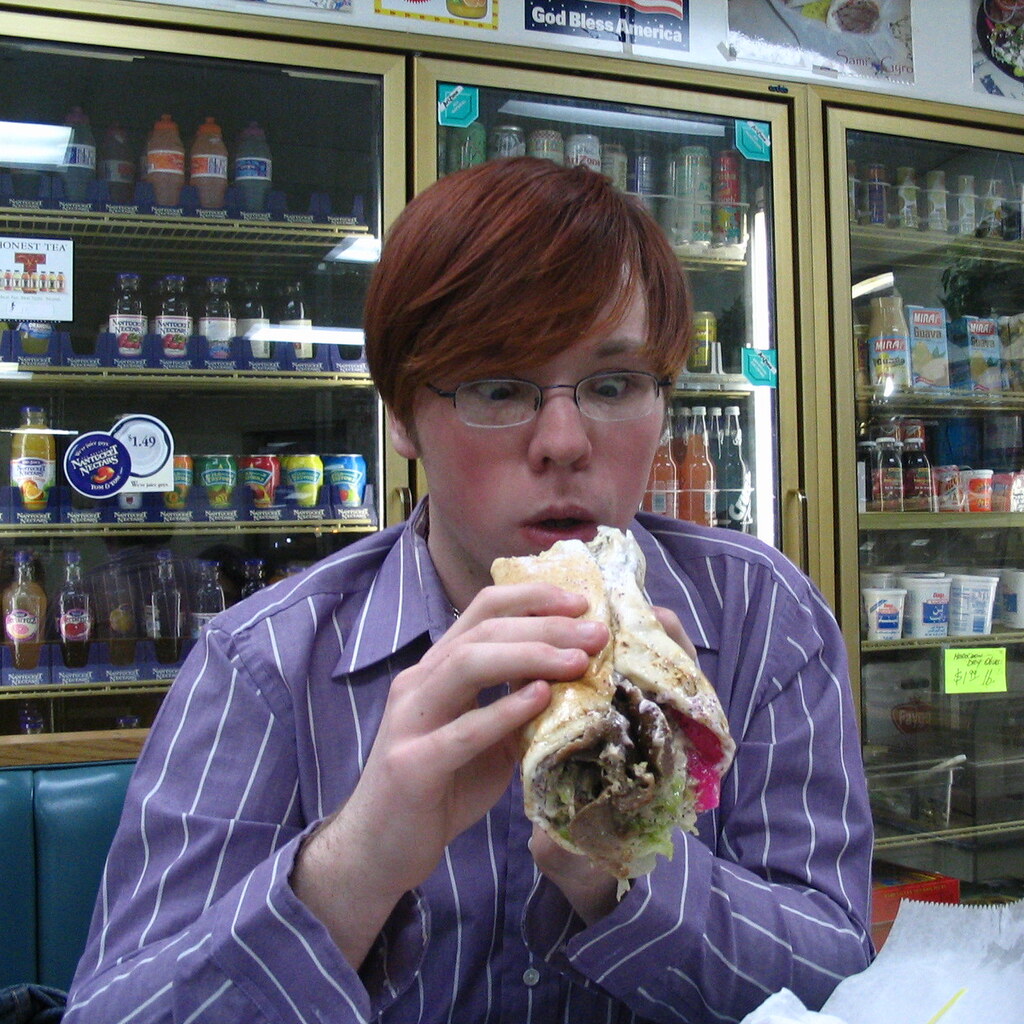 Photo of someone eating a gyros