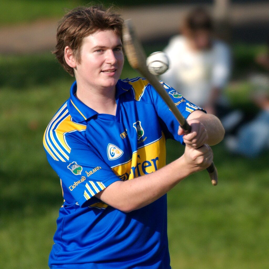 Photo of a man hitting a ball