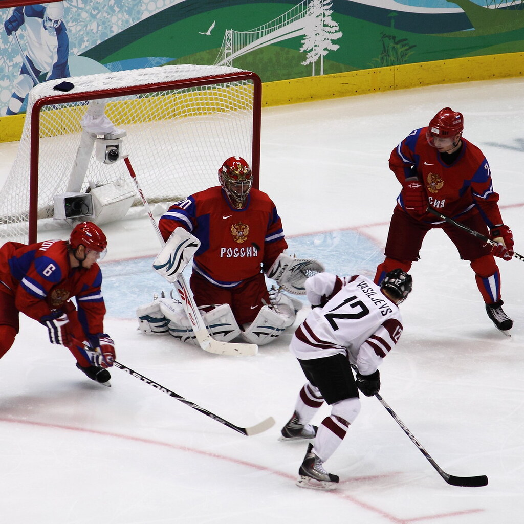 Photo of people playing hockey