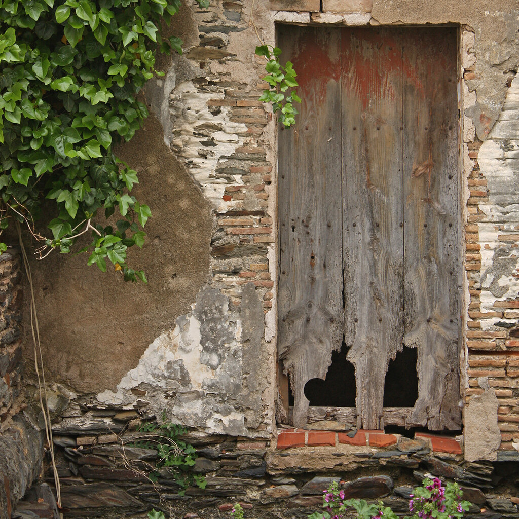 Photo of a door with two holes in it