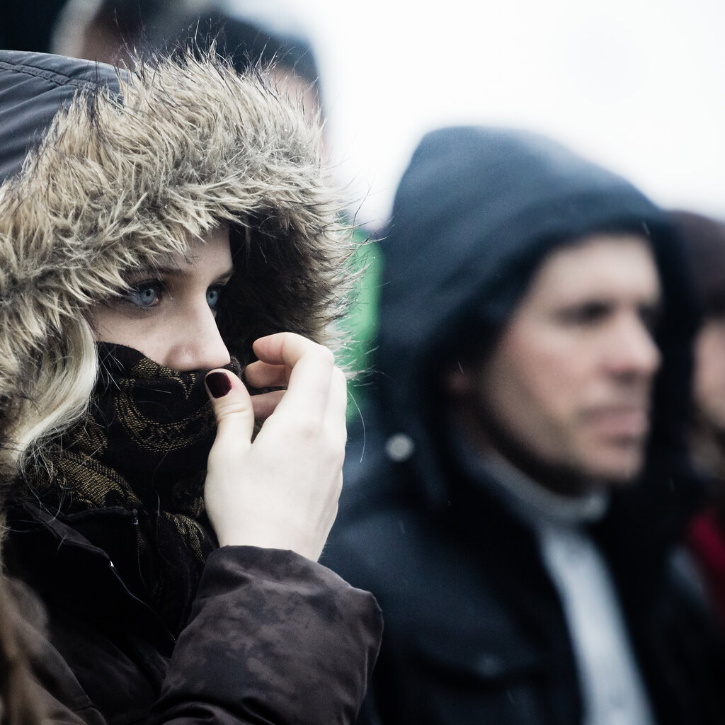 Photo of a woman wearing a hooded jacket.