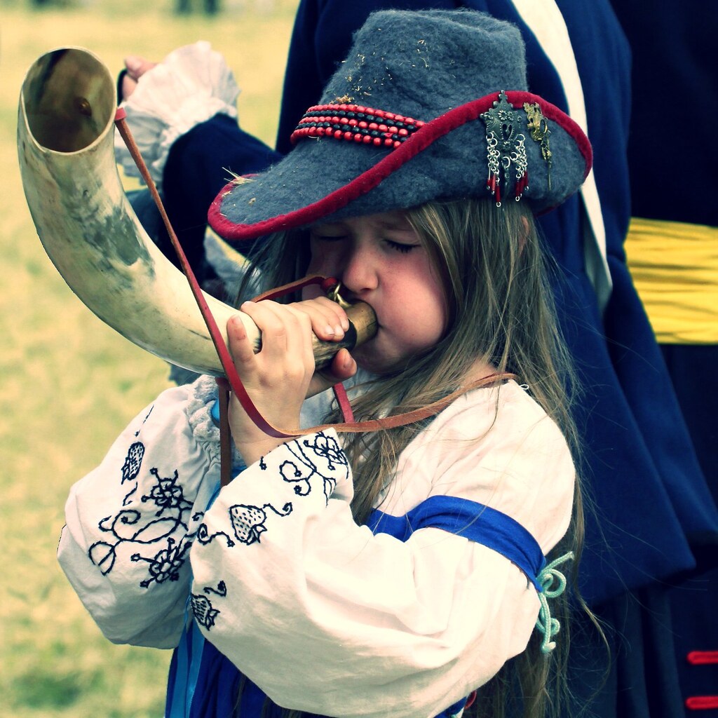 Photo of a child blowing a horn