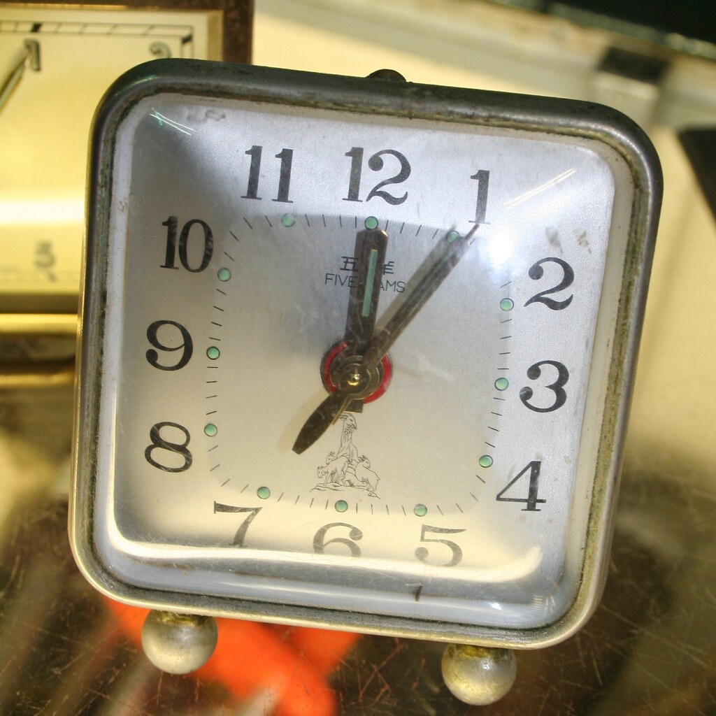 Photo of a clock showing one o'clock