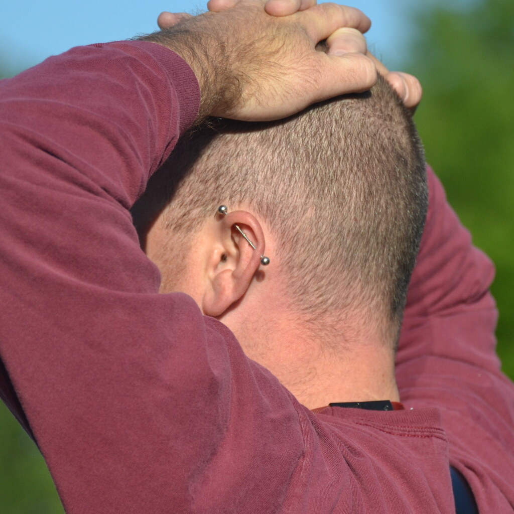 Photo of a man with an industrial piercing