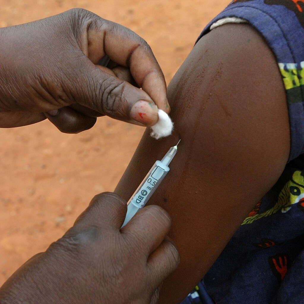 Photo of someone injecting a vaccine