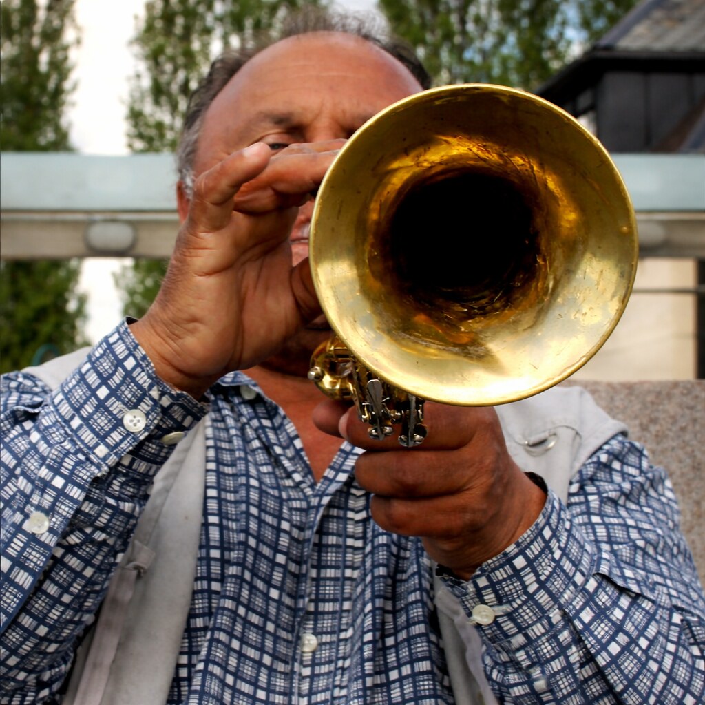 Photo of a man playing the trumpet