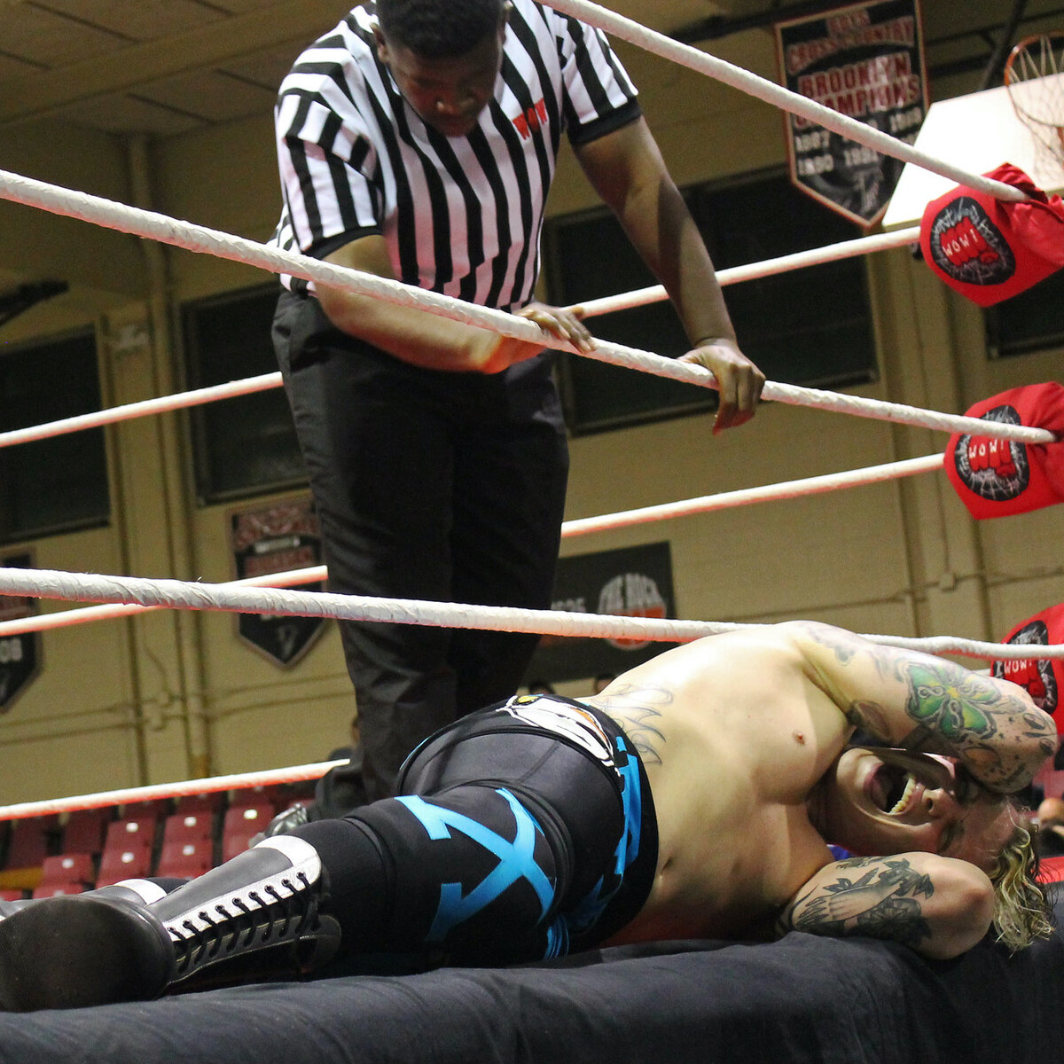 Photo of a wrestler down for the count