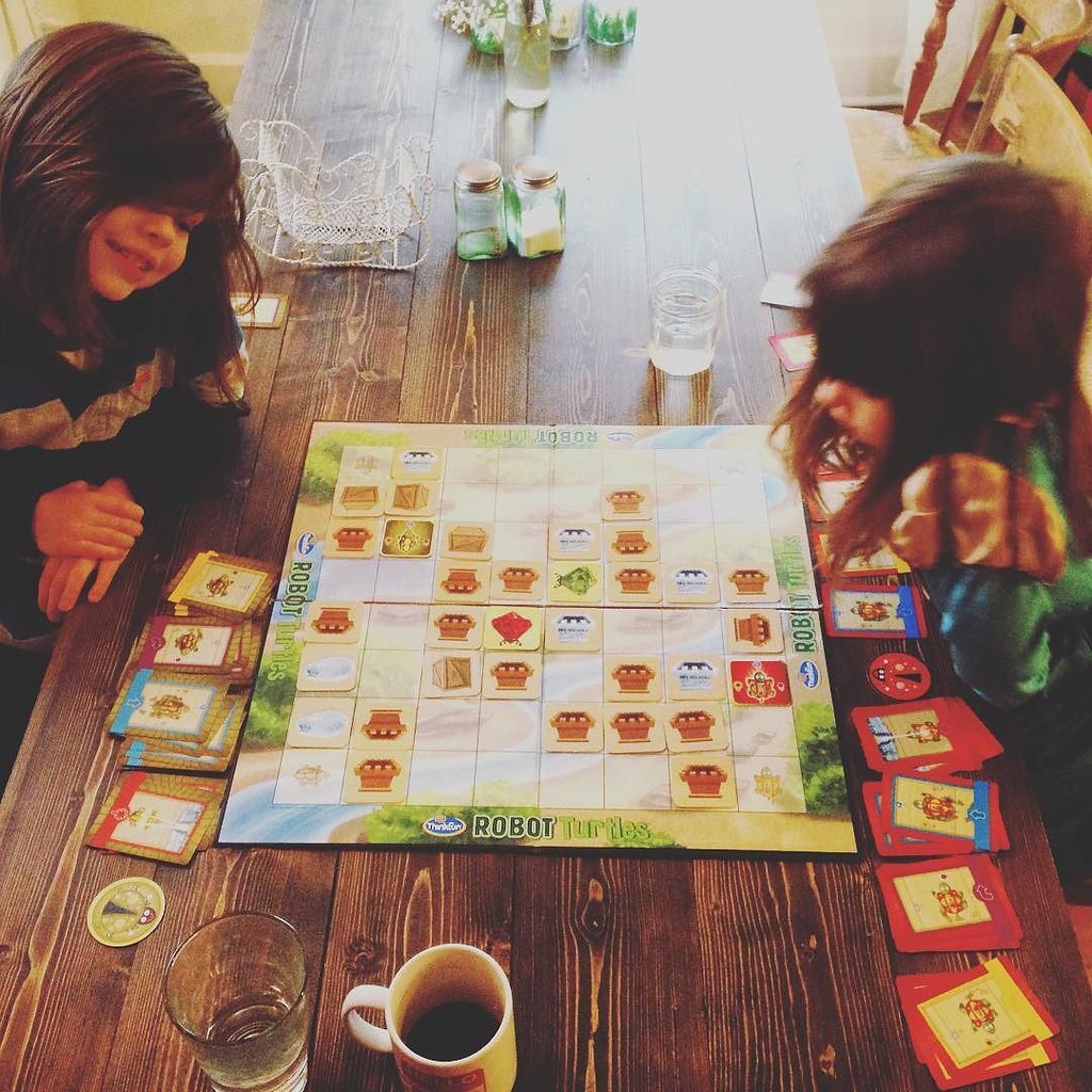 Photo of two children playing board games