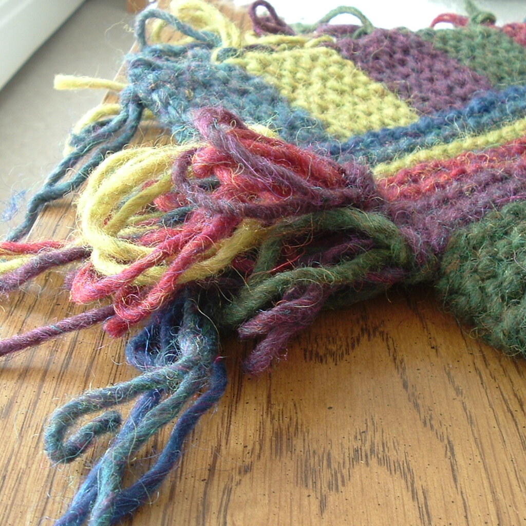 Photo of an unfinished scarf with loose ends