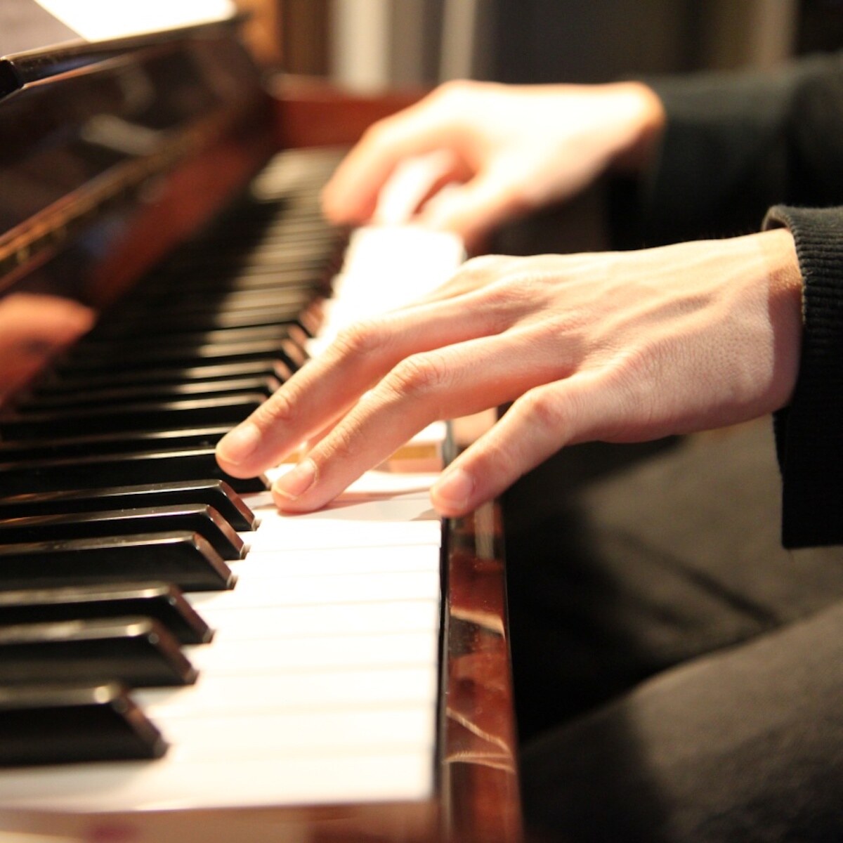 Photo of a man playing the piano